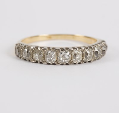 Lot 101 - A diamond half eternity ring, set with ten...