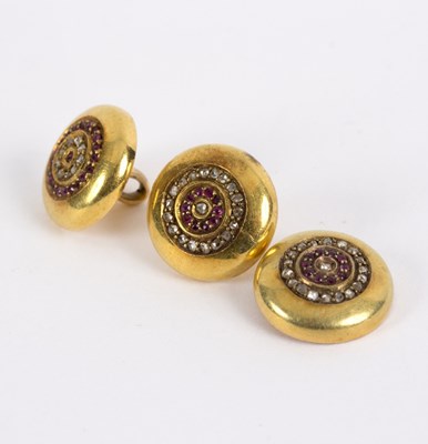 Lot 106 - Three Edwardian 15ct gold dress buttons, each...