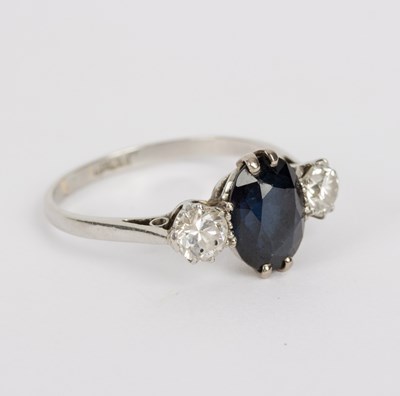 Lot 108 - A sapphire and diamond three-stone ring, the...
