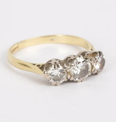 Lot 109 - A diamond three-stone ring, claw set in 18ct...