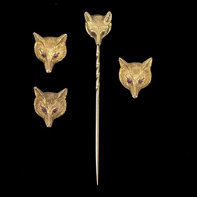 Lot 121 - A 9ct gold fox mask stick pin and three...