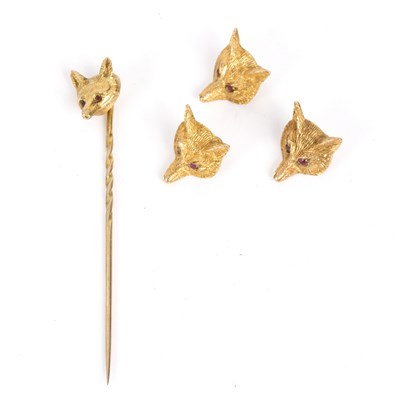 Lot 121 - A 9ct gold fox mask stick pin and three...