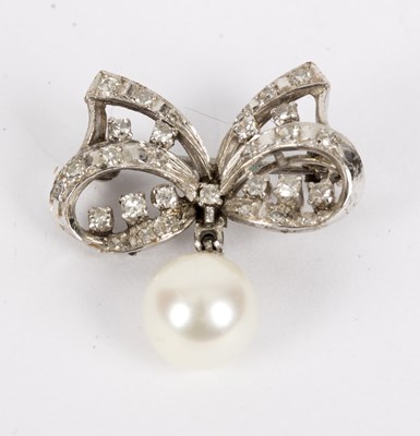 Lot 126 - A diamond and cultured pearl bow brooch, the...