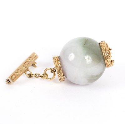 Lot 127 - A Chinese jade and 14K gold brooch, the large...