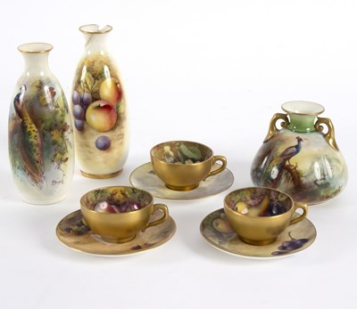 Lot 186 - Two small Royal Worcester cups and saucers...