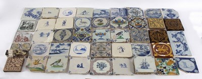 Lot 201 - A group of tiles to include Delft, slip...