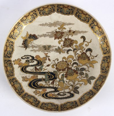 Lot 220 - A Japanese Satsuma plate decorated butterflies...