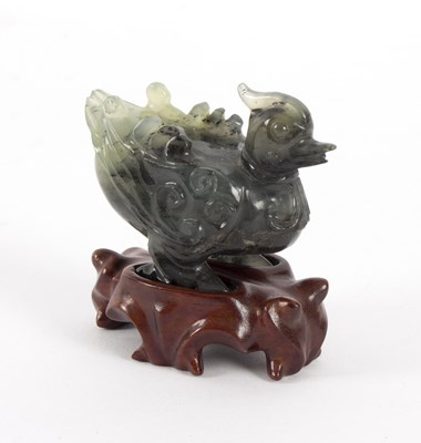 Lot 268 - A carved jade figure of a mandarin duck, 20th...