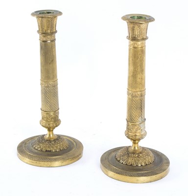 Lot 352 - A pair of Empire style gilt metal candlesticks,...