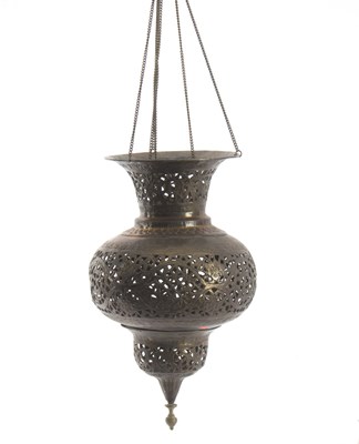 Lot 353 - A Middle Eastern pierced brass hanging lantern,...