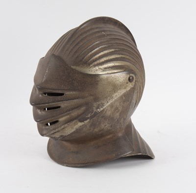 Lot 392 - A steel helmet with visor and ribbed crested...