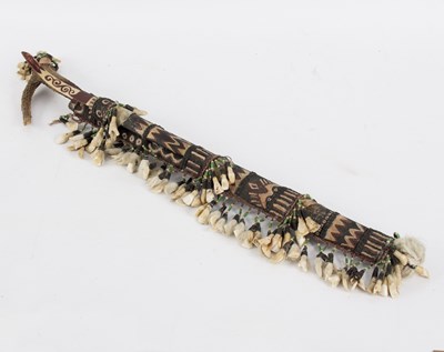 Lot 404 - A Borneo Dayak Mandau sword, hung with teeth...