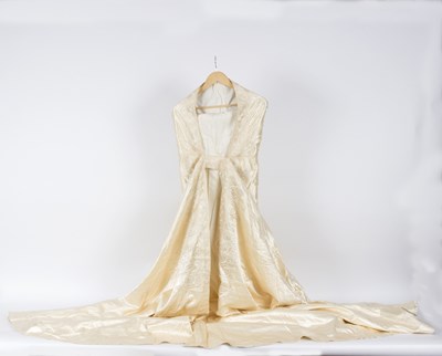 Lot 432 - A cream silk cape, with hood with applied tape...