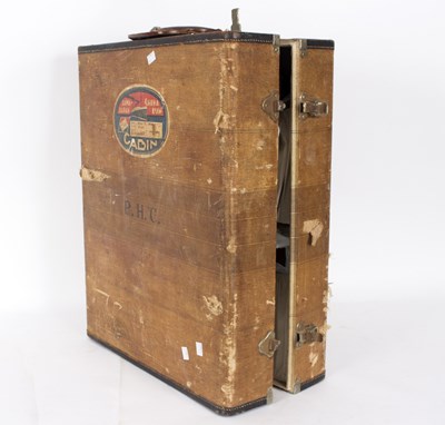 Lot 438 - A canvas covered travelling trunk containing a...