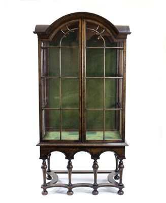 Lot 518 - A walnut arch top cabinet of late 17th Century...