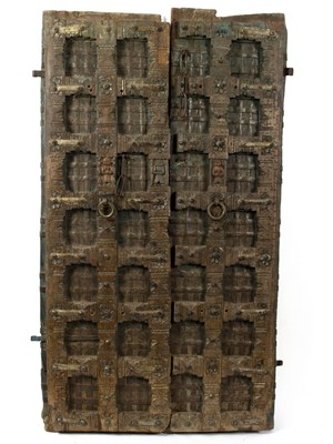 Lot 520 - A pair of Eastern carved wooden doors with...