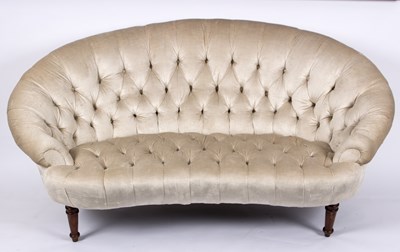 Lot 550 - A cream upholstered button back two seater...