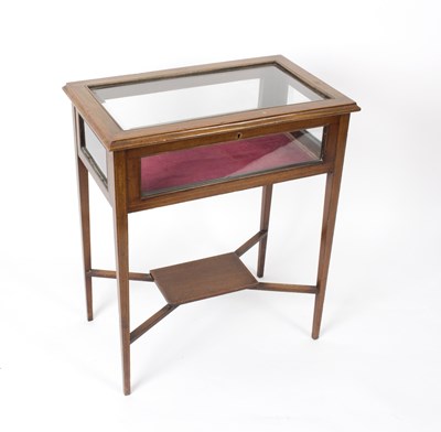 Lot 573 - An Edwardian mahogany display table, on square...