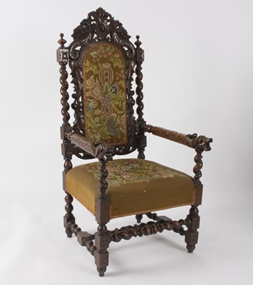 Lot 592 - A Carolean style carved oak armchair with...