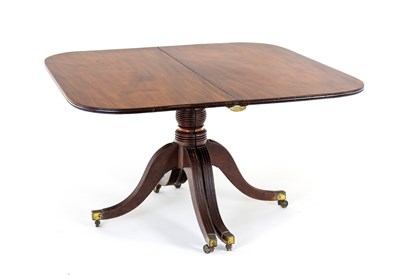 Lot 606 - A George III mahogany two-pillar dining table...