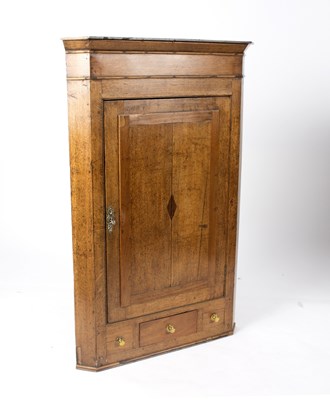 Lot 646 - An early 19th Century oak corner cupboard with...