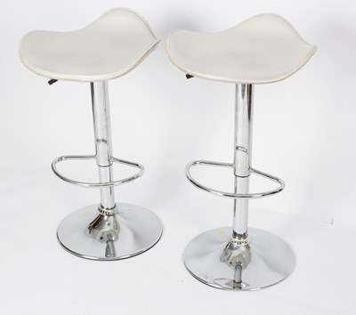 Lot 650 - A pair of chromium telescopic bar stools with...