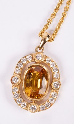 Lot 79 - An 18ct gold, diamond and yellow sapphire pendant