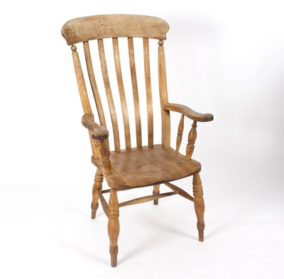 Lot 731 - A pine armchair with rail back