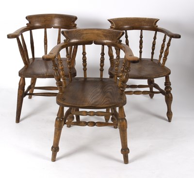 Lot 732 - Three elbow chairs with dished elm seats