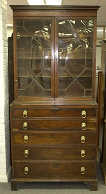 Lot 768 - A George III mahogany secretaire bookcase, the...