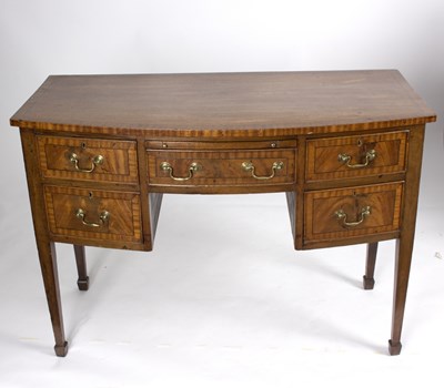 Lot 787 - A George III style mahogany bowfront dressing...