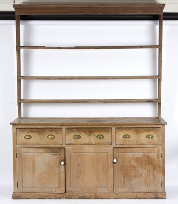 Lot 799 - A pine dresser with shelves over, fitted...