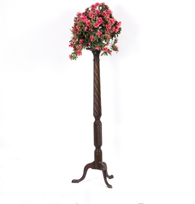 Lot 802 - A mahogany torchère, with spiral column on a...