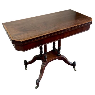 Lot 806 - A 19th Century mahogany fold-over tea table...