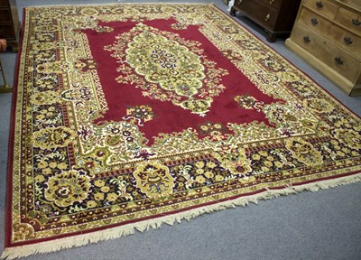 Lot 819 - A large modern carpet, worked with floral...