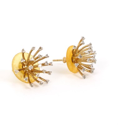 Lot 17 - A pair of diamond set starburst earrings, each...