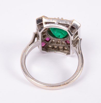 Lot 95 - An 18ct white gold, emerald, ruby and diamond ring