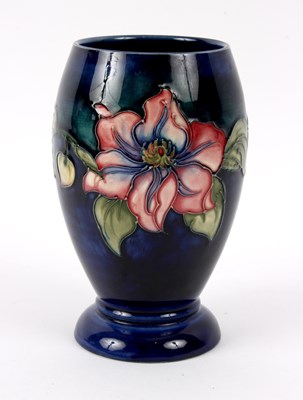 Lot 147 - Moorcroft, a Clematis pattern vase, tubeline...