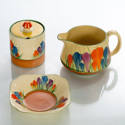 Lot 150 - Clarice Cliff, a Crocus pattern sugar bowl and...