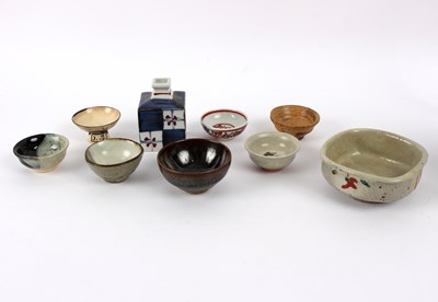 Lot 213 - Rokubei Kiyomizu, a set of four sake cups in a...