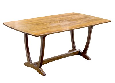 Lot 466 - Cotswold School, an oak dining table, to a...