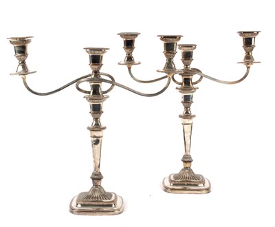 Lot 2 - A pair of Sheffield plate candlesticks with...