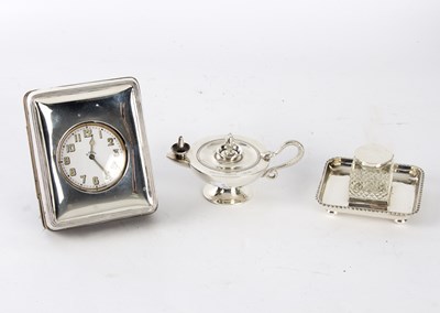 Lot 75 - A silver table lighter, marks rubbed, modelled...