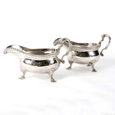 Lot 98 - A pair of George II silver sauce boats, makers...