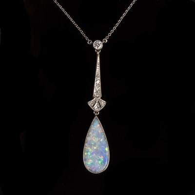 Lot 143 - An Art Deco opal and diamond pendant, the drop...