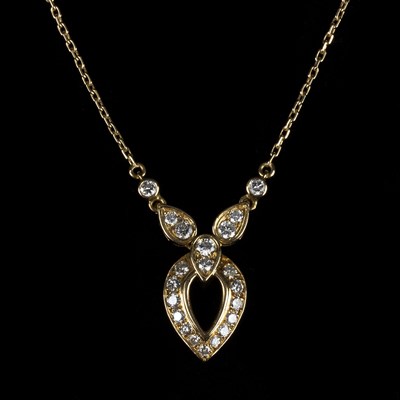 Lot 150 - A Cartier diamond necklace, the drop pierced...