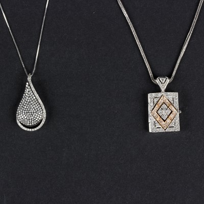 Lot 155 - A diamond teardrop pendant with openwork back...