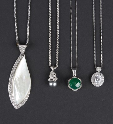 Lot 164 - Four various gem pendants, to include a green...