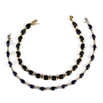 Lot 174 - A sapphire and diamond line bracelet, the...