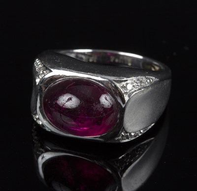 Lot 180 - A ruby and diamond dress ring, the oval ruby...